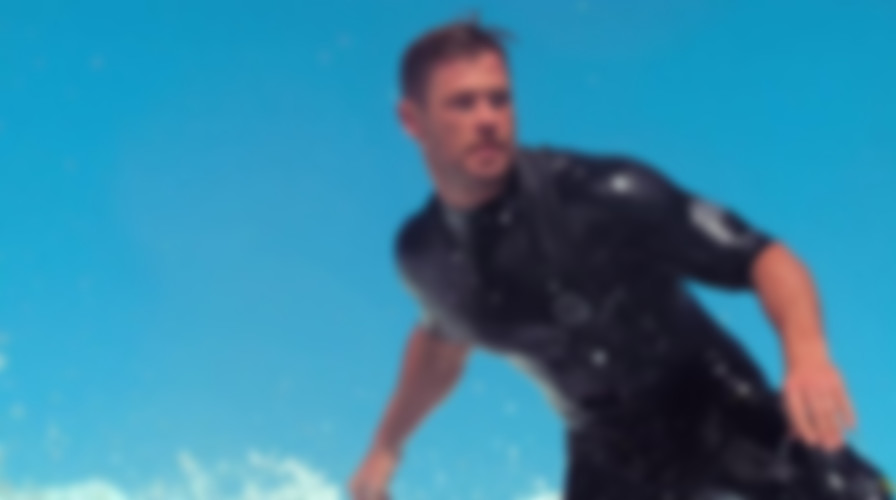 Shark Beach with Chris Hemsworth backdrop